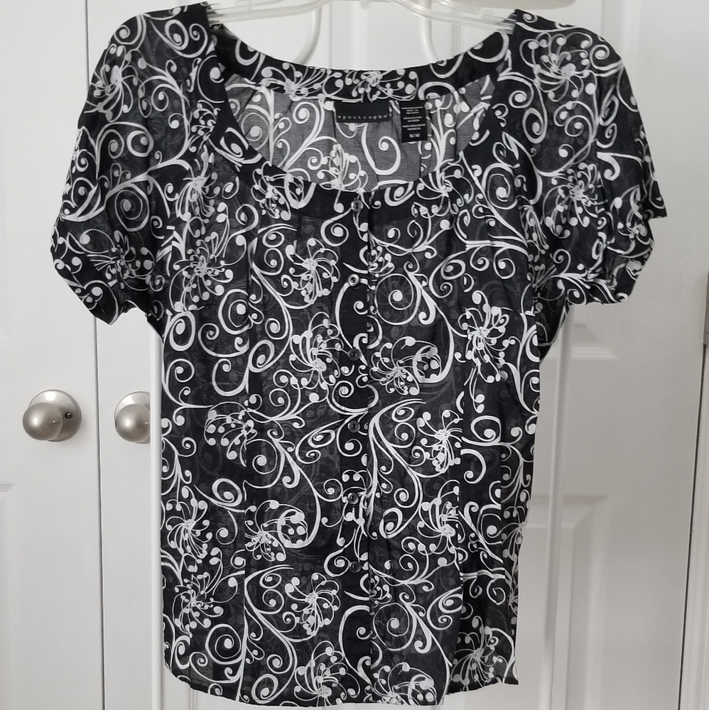 Apostrophe tieback blouse.